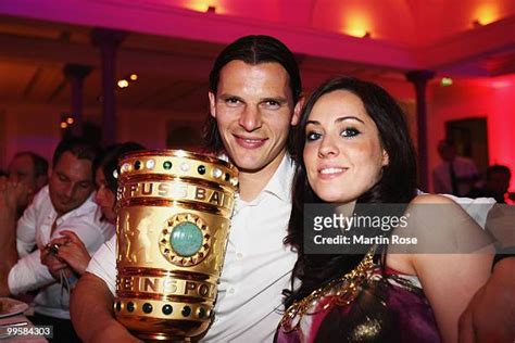 Daniel van Buyten and his girlfriend Celine pose with the DFB 